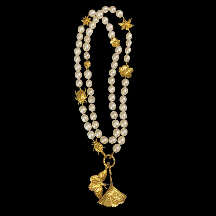 Charmed Semi Round Pearl Opera Length Necklace With Giko and Monarch Drops